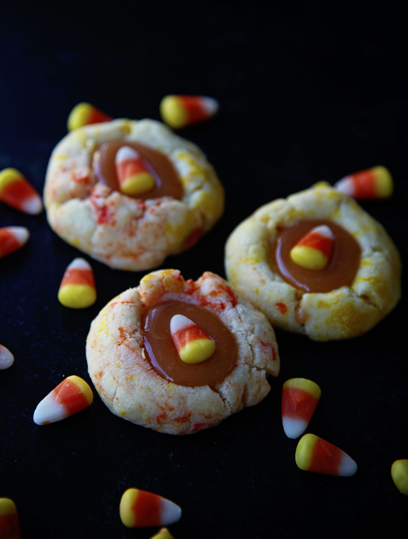 https://www.sweetrecipeas.com/wp-content/uploads/2021/10/Candy-Corn-Caramel-Thumbprint-Cookies-01.jpeg