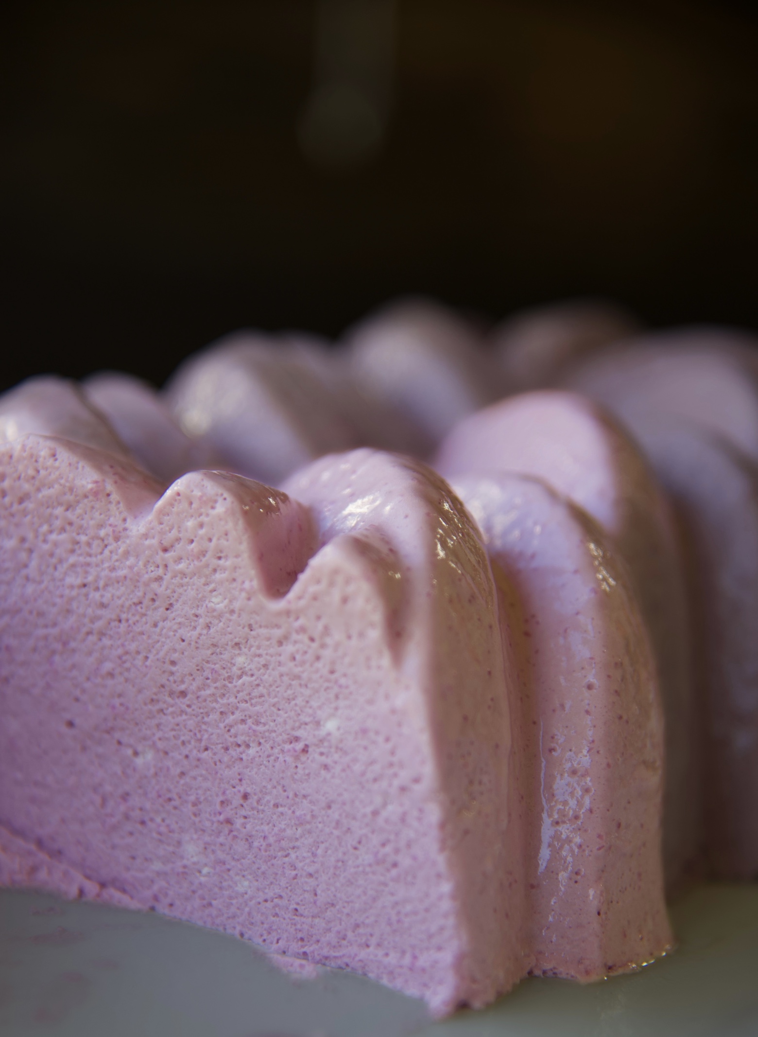 Close up of a slice of Grape Popsicle Jello Mold cut to expose the light and fluffy jello mold. 