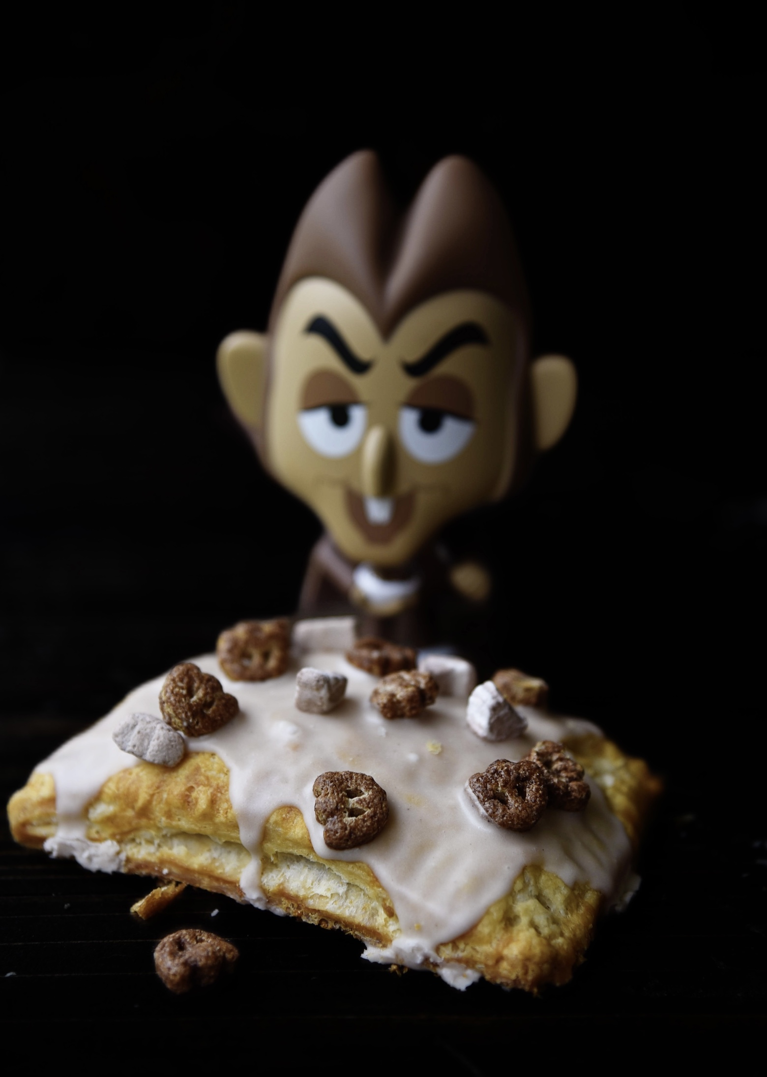 Single Count Chocula Pop Tart with Count Chocula figurine behind it