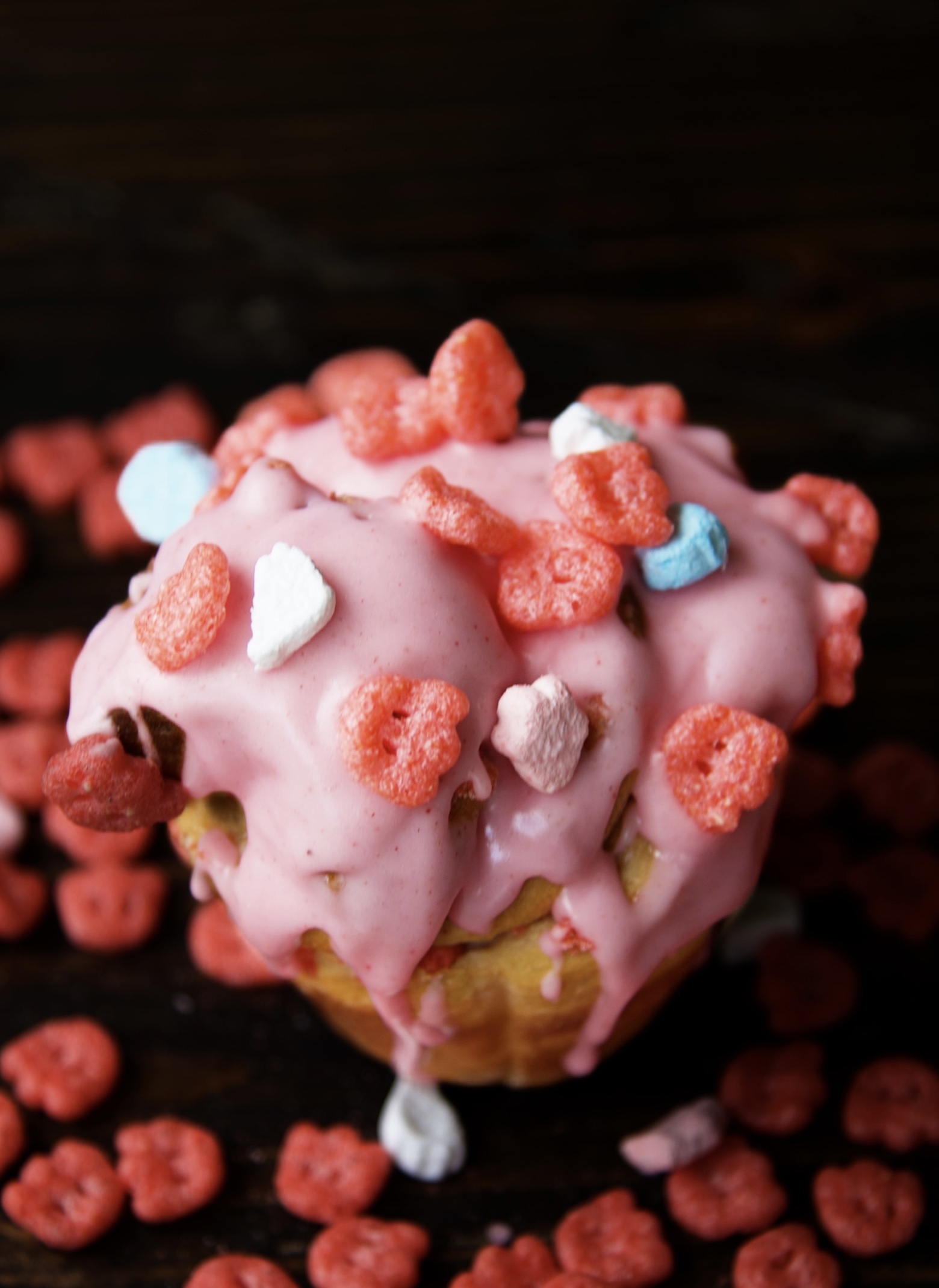 Close up of the pink icing with the Franken Berry cereal on top of it